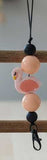 Flamingo charm with pink beads on a wooden stick