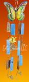 Butterfly-shaped wind chime with colorful elements on an orange background