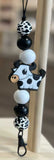 Cow-shaped  freshie hanger with beads on a stick