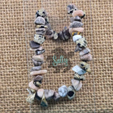 A hand-made bracelet made with a combination of dalmatian and marble stones