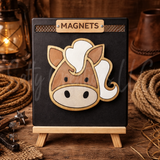 Magnet shaped like a horse head on a stand with a rustic background
