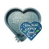 Heart-shaped mold with decorative text and a 'Stay Wild Gypsy Soul' heart-shaped sign on a white background.