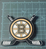 Cardstock on a hockey and puck silicone mold on a cutting mat with measurement markings