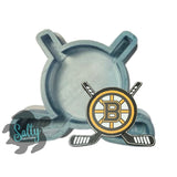 Hockey puck with crossed sticks and a logo on a white background, featuring 'Salty Creations' branding.