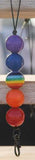 Colorful beaded keychain with a rainbow design on a blurred background