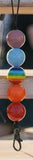Set of colorful beads on a keychain with a blurred background