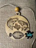 A wooden car charm with a Texas Slam design, featuring images of three fish 