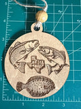 A wooden car charm with a Texas Slam design, featuring images of three fish on a measuring mat