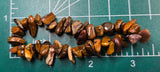 Tigers eye bracelet on a measuring mat about 7 inches in circumference