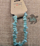 A bracelet made with green aventurine stones, displayed on a textured background with a handmade label that reads 'HANDMADE WITH LOVE' and the brand name 'SALTY CREATIONS'.