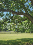 Handmade wind chime by Sally Creations LLC featuring a natural deer antler base and teal glass pendants hanging from an oak tree